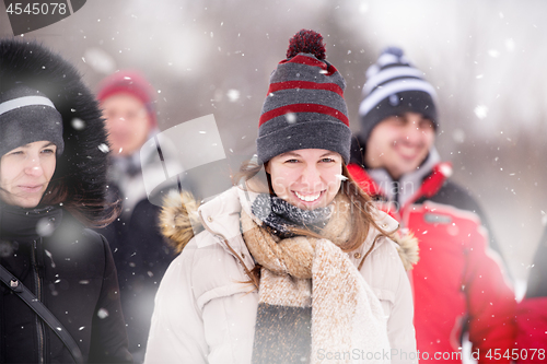 Image of Portrait of young woman on snowy winter day