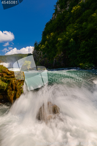 Image of single stone in wild river