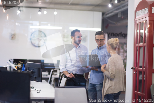 Image of Business team Working With laptop in creative office