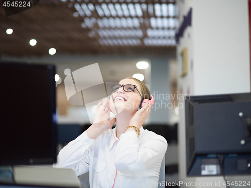 Image of businesswoman using a laptop in startup office