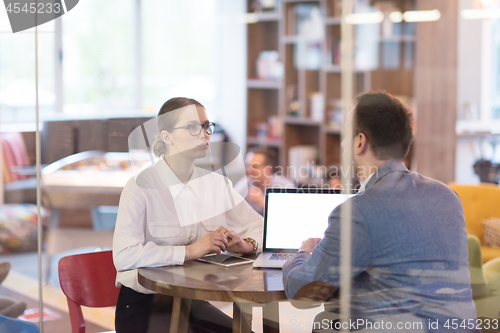 Image of Business team Working With laptop in creative office