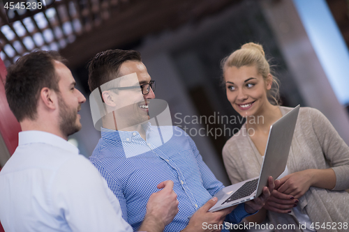 Image of Business team Working With laptop in creative office