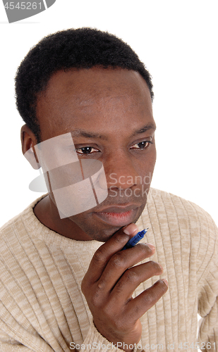 Image of Close up portrait of African man looking thoughtful