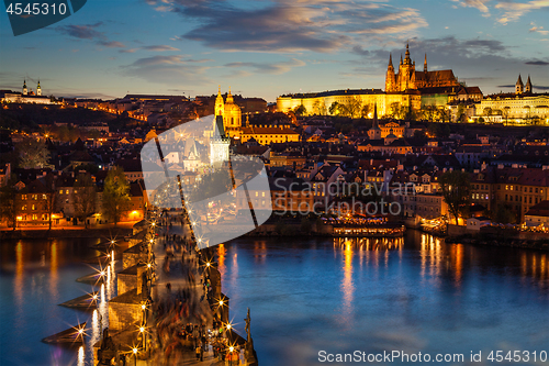 Image of Night view of Prague castle and Charles Bridge over Vltava river