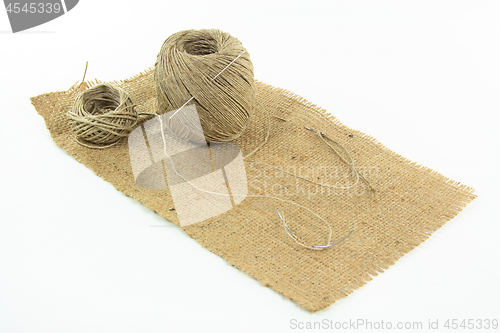 Image of Sewing burlap. 