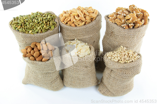 Image of Nuts and seeds in burlap bags. 