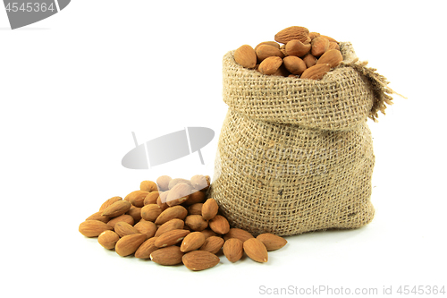 Image of Natural Whole Almonds nuts in burlap bag. 