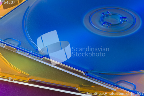 Image of CD or DVD disks in colorful jewel cases