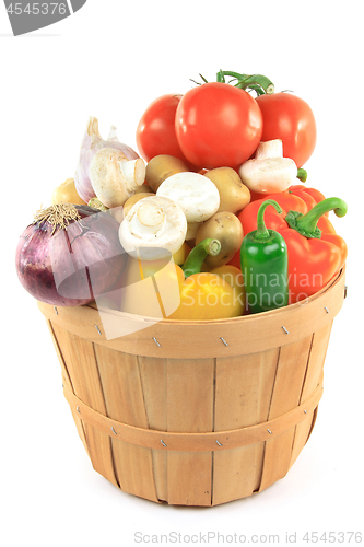 Image of Vegetables in wooden bushel basket. 
