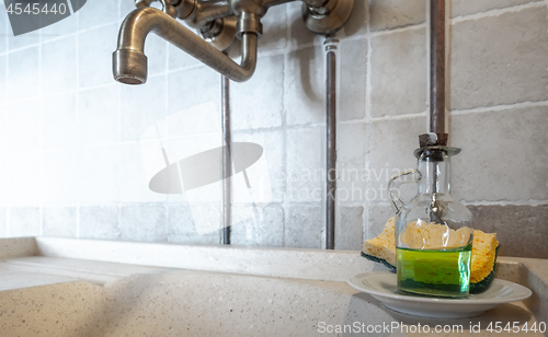 Image of vintage dishwashing sink in a kitchen in Italy