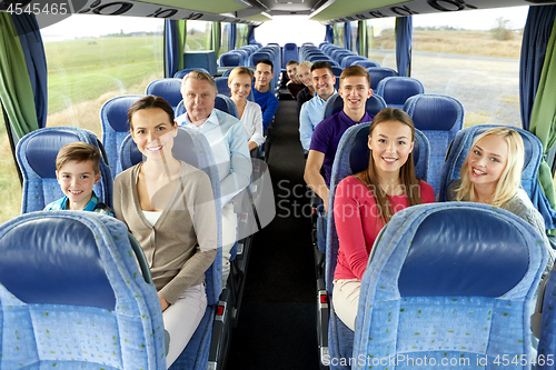 Image of group of happy passengers travelling by bus