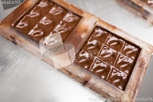 Image of chocolate in candy mold at confectionery shop