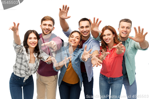 Image of group of happy students over white background