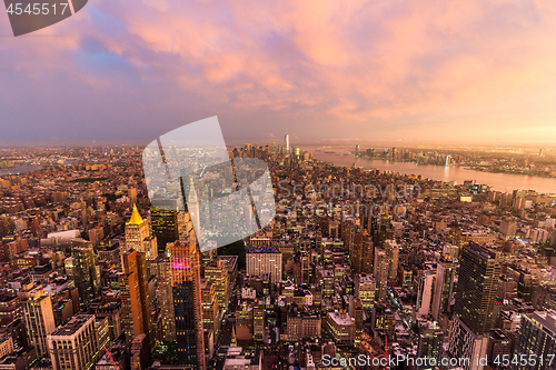 Image of New York City skyline with Manhattan skyscrapers at dramatic stormy sunset, USA.