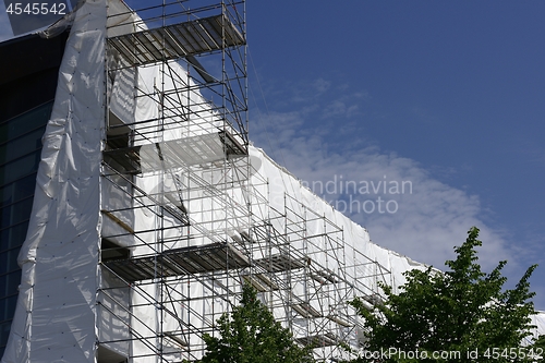 Image of fabric covered facade during building renovation