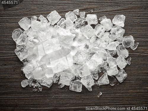 Image of ice cubes on wooden table