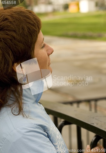 Image of redhead woman on the bridge