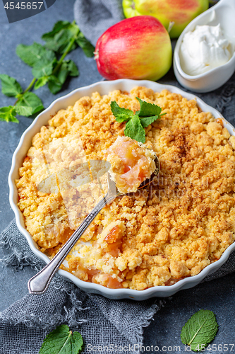 Image of Homemade apple crumble with cinnamon.