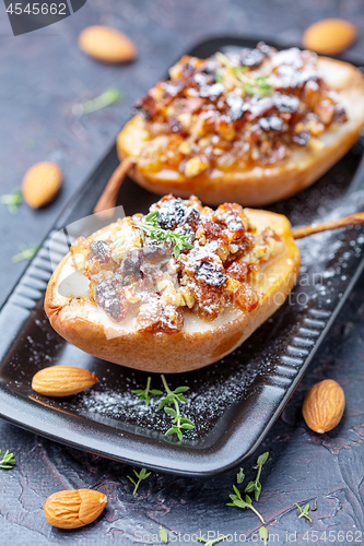 Image of Pears baked in honey with raisins and nuts.