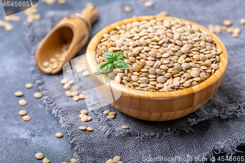 Image of Bowl of brown lentils. Vegetarian food.