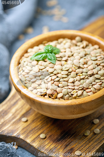 Image of Brown organic dried lentils close up.