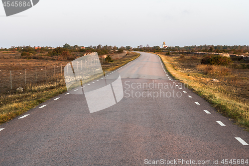 Image of Morning sunshine at a country road in a barren grassland