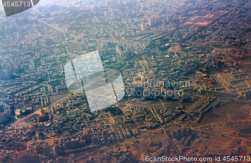 Image of Journey by air. A view of city from plane.