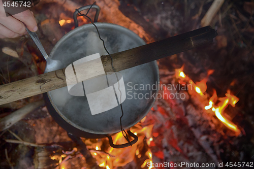 Image of picnic in winter on nature of a bonfire