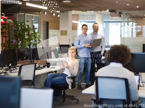 Image of businessman working using a laptop in startup office