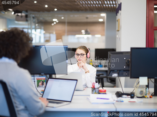 Image of businesswoman using a laptop in startup office