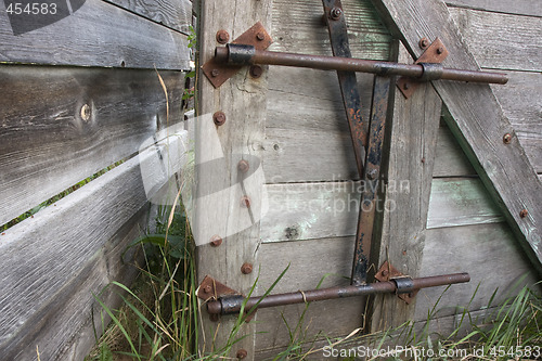 Image of gate with a lock in an old cattle ranch