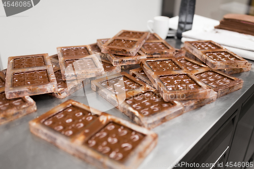 Image of chocolate in candy molds at confectionery shop