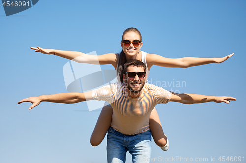 Image of happy couple having fun in summer