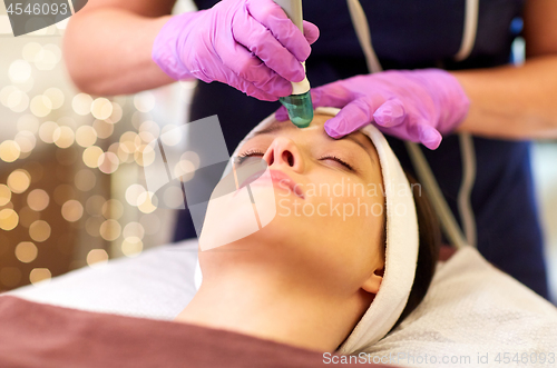 Image of woman having microdermabrasion facial treatment