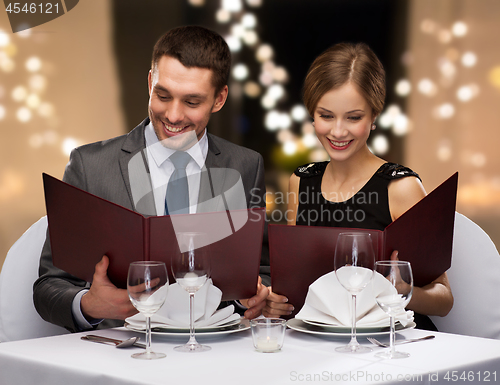 Image of couple with menus at restaurant