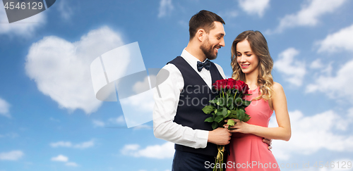Image of couple with bunch of flowers on valentines day