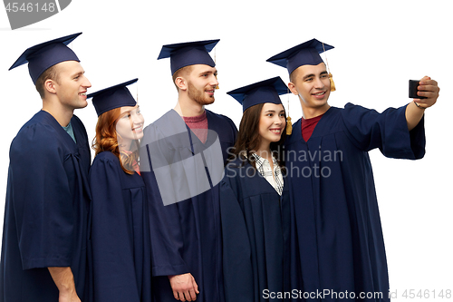 Image of graduates taking selfie by smartphone