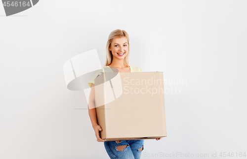 Image of happy woman holding big cardboard box