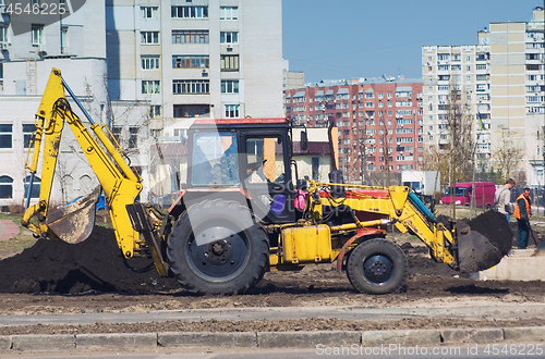 Image of tractor on a city street