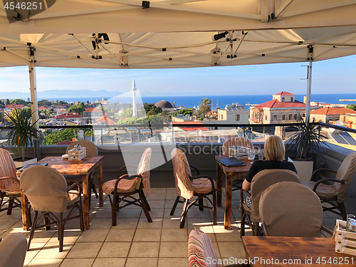 Image of Panoramic view of old town Rhodes from summer  restaurant terrac