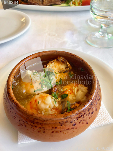 Image of bowl of garlic prawns