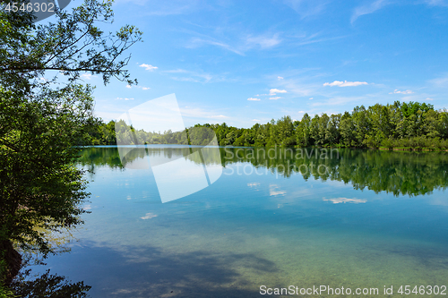 Image of Forest lake in German national park with clear blue sky reflecti