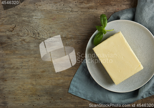 Image of butter on old wooden table