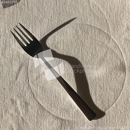 Image of Fork with long shadow