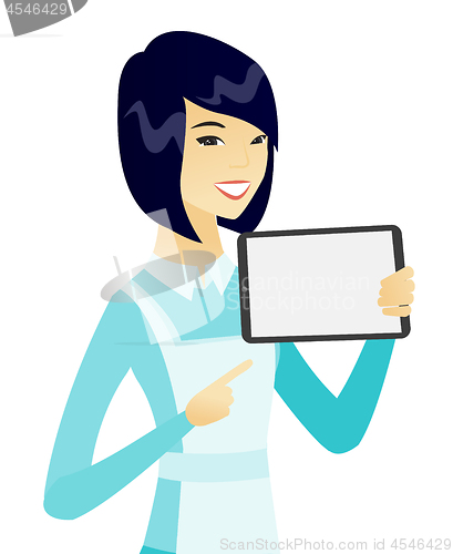 Image of Young asian cleaner holding tablet computer.