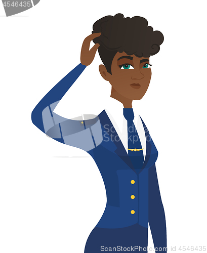 Image of Young african-american stewardess scratching head.