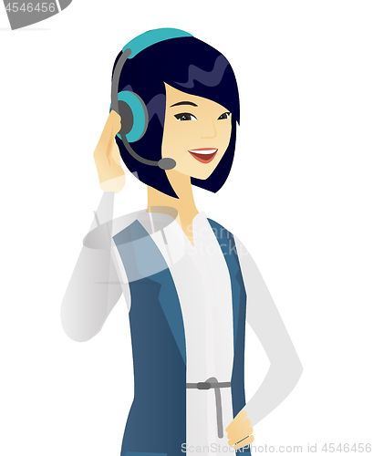 Image of Young asian customer service operator in headset.