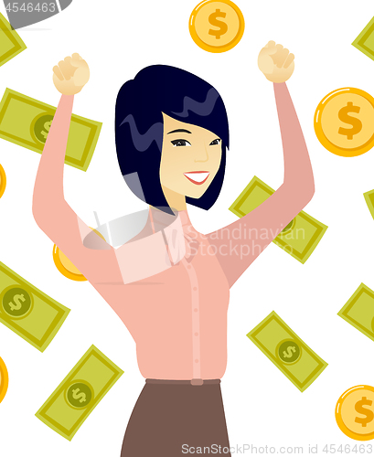 Image of Young asian business woman under money rain.