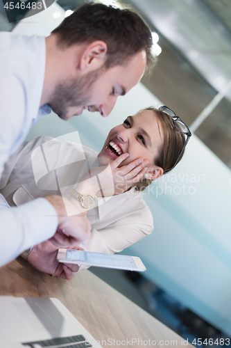 Image of Business People Working With Tablet in startup office