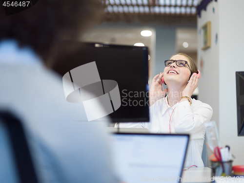 Image of businesswoman using a laptop in startup office